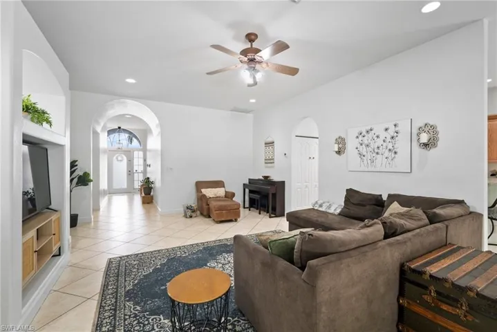 Tiled living room with ceiling fan