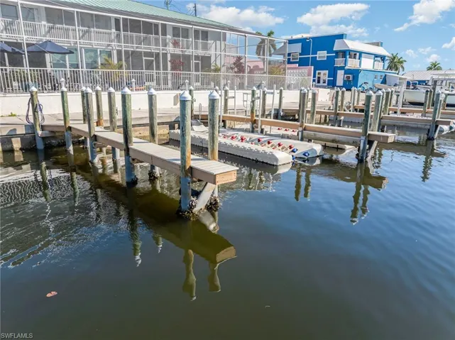 Dock area featuring a water view