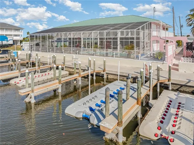 Dock area with a water view and boat lift