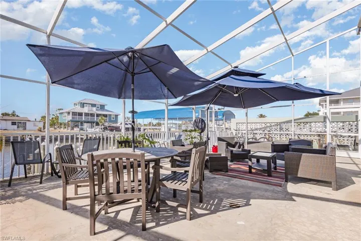 View of patio featuring a  screen enclosure