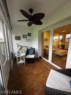 Sunroom / solarium with ceiling fan and french doors