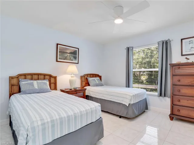 Tiled bedroom with ceiling fan