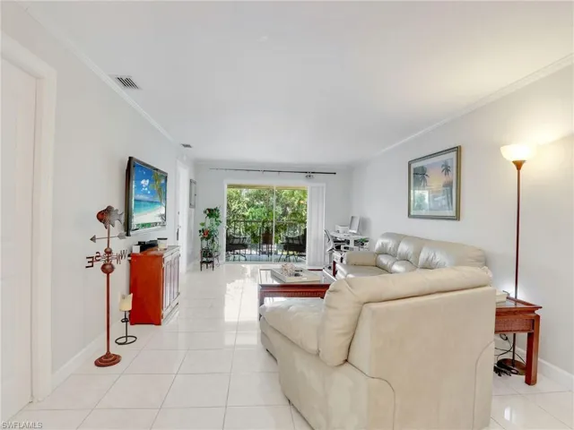 Tiled living room with ornamental molding