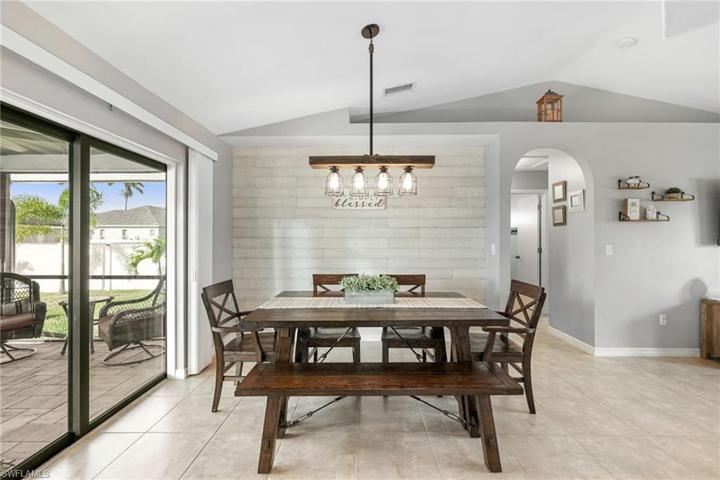 Dining area with modern light fixture.