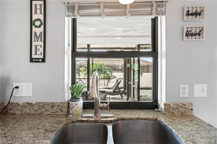Enjoy a view out to the pool from the kitchen.  All impact winows throughout.