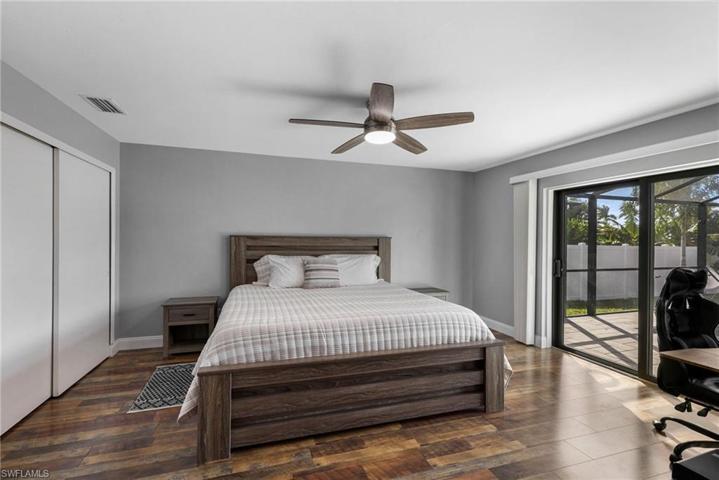 Master bedroom with plenty of room for a king size bed.  Impact rated sliding glass doors out to the pool.