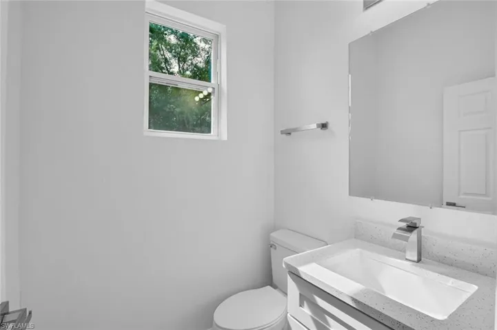 Bathroom with vanity and toilet