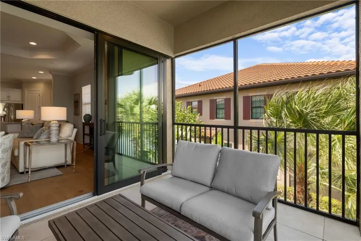 Balcony featuring a sunroom