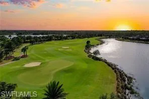 Bird's eye view of a golf course and a large body of water