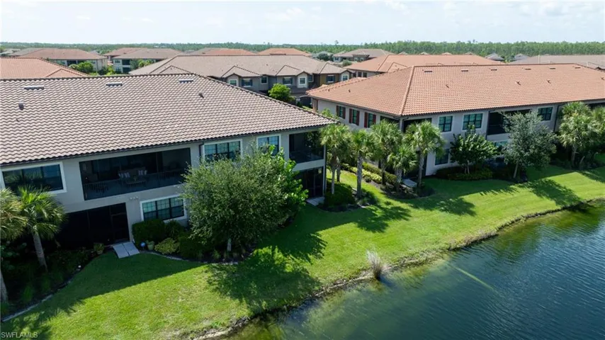 Aerial perspective of suburban area with a large body of water