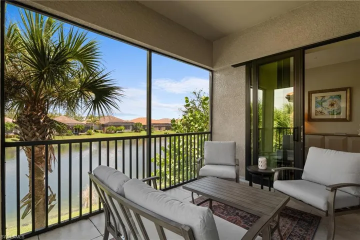 Sunroom with a water view