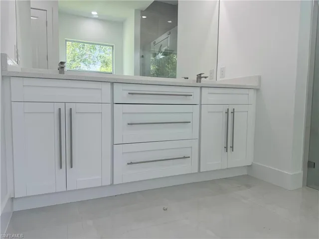 Bathroom featuring sink and tile patterned flooring