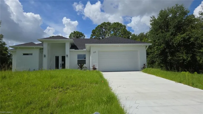 View of front of property featuring a garage