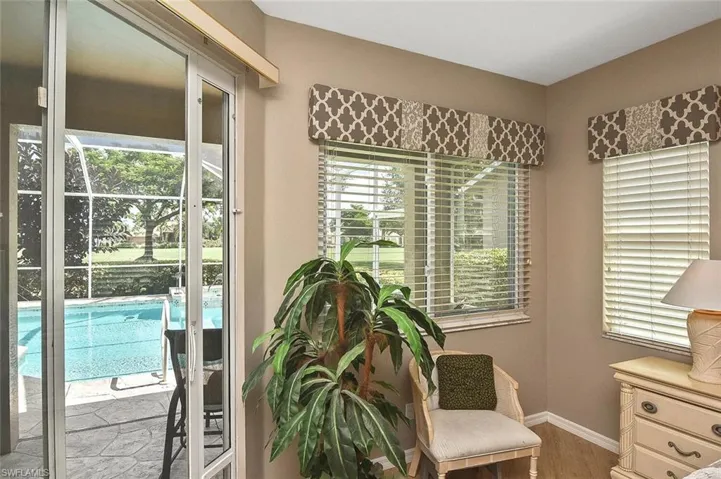 Sitting room featuring wood finished floors and baseboards