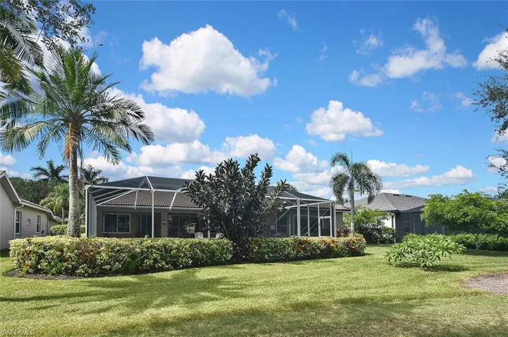 View of green lawn with a lanai