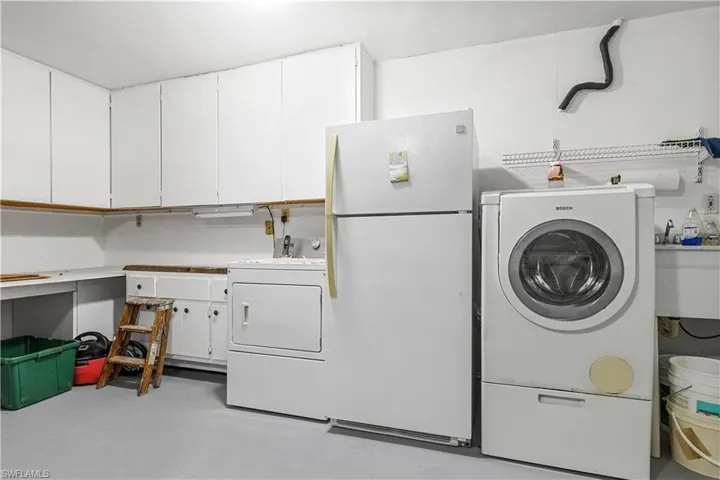 Laundry, deep sink and work shop area