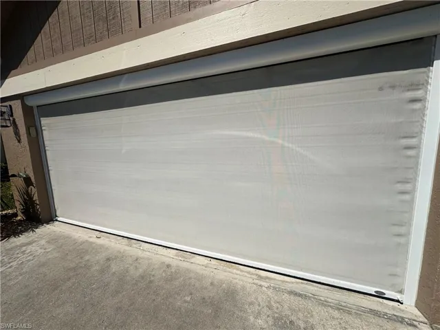 View of garage with drop down screen