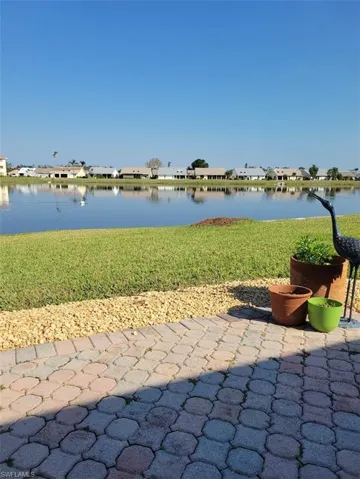 View of patio / terrace featuring a residential view and a water view