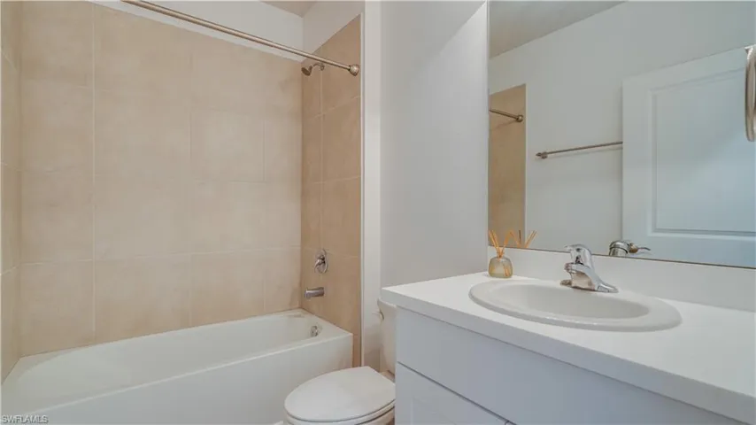 Bathroom with vanity and shower / bath combination