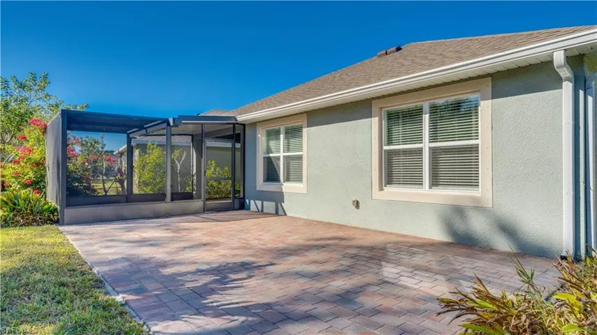 View of patio featuring a lanai and a sunroom