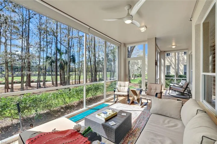 Sunroom featuring a ceiling fan