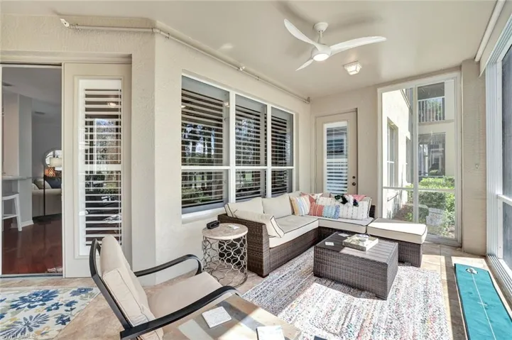 Sunroom / solarium with a ceiling fan