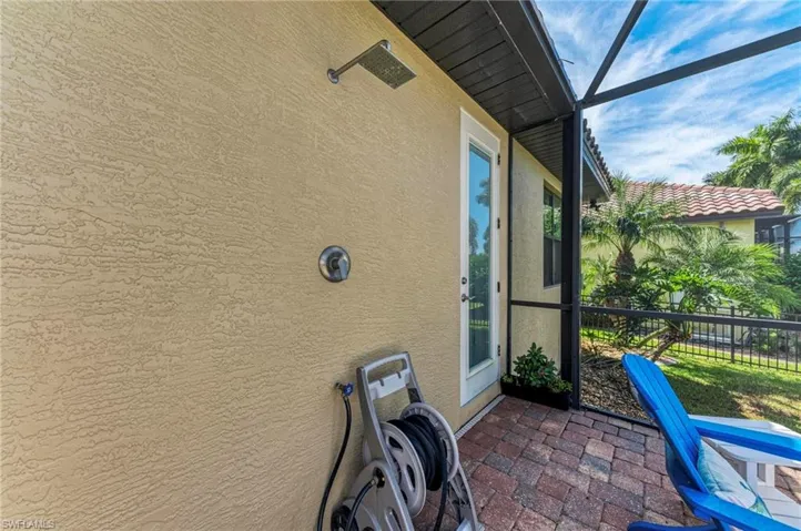 View of patio with a lanai