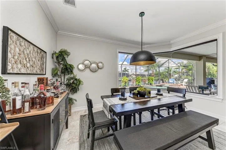 Dining area featuring ornamental molding