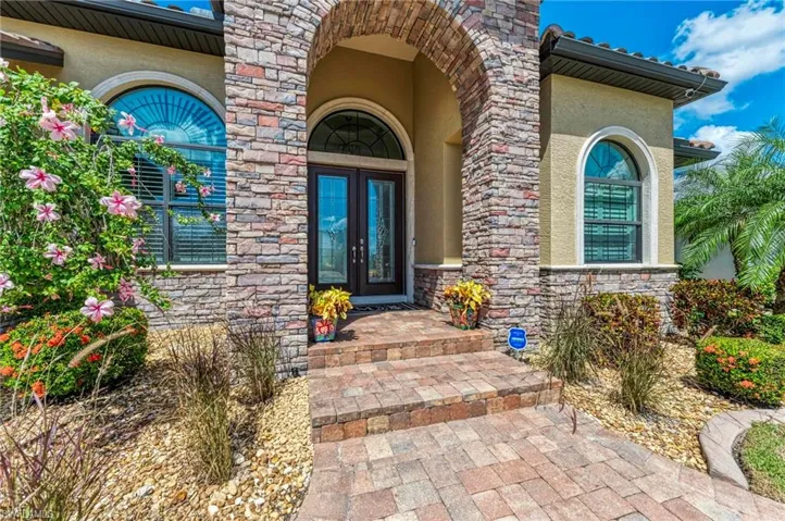 Property entrance featuring french doors