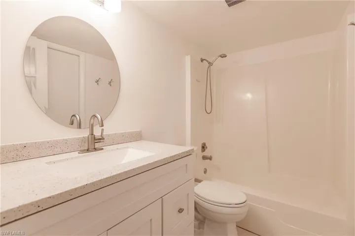 Full bathroom featuring bathing tub / shower combination and vanity