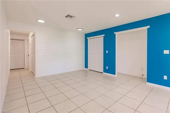 Unfurnished room featuring recessed lighting and light tile patterned flooring