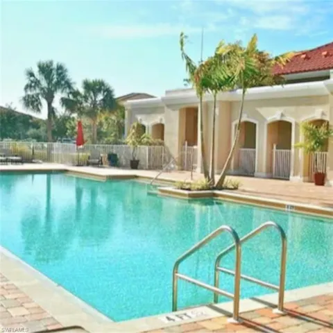 Community swimming pool with brick paver decking