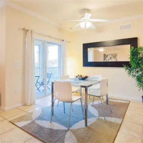 Dining area with tile flooring and a ceiling fan