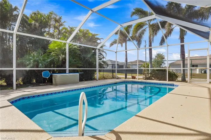 View of pool featuring a patio area and a lanai