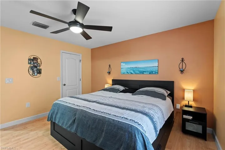 Bedroom featuring a ceiling fan and light wood-style flooring