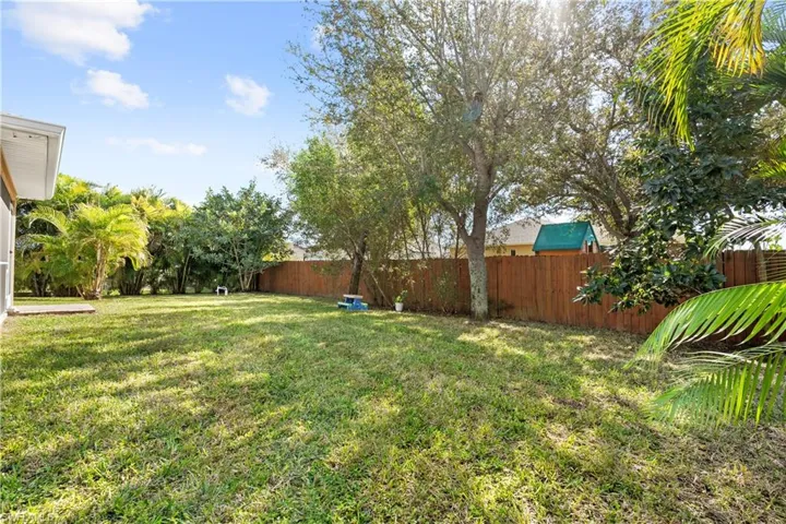 View of fenced backyard