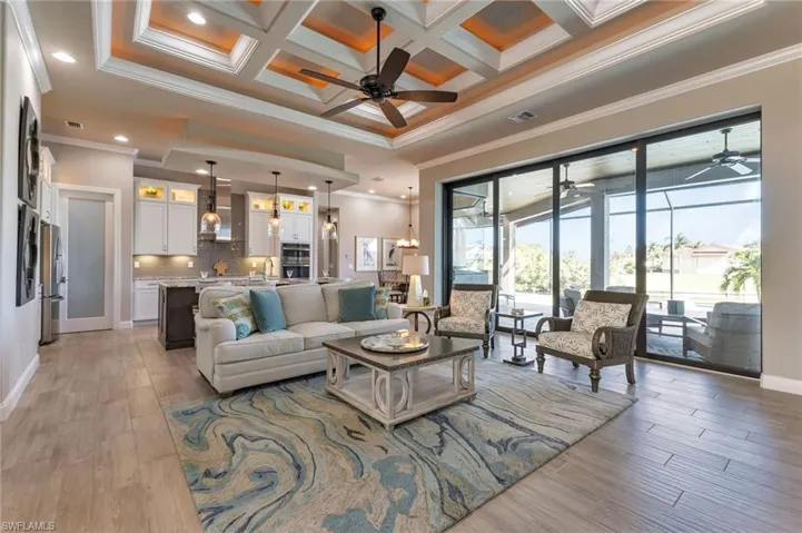 Living room featuring coffered ceiling
