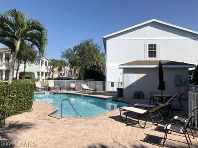 Community pool with a patio area