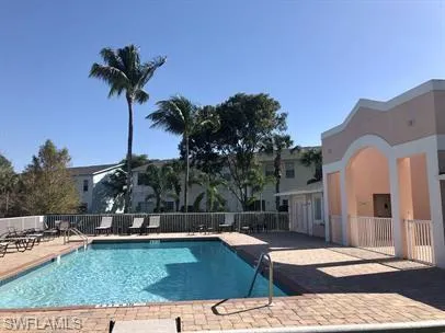 Community pool featuring a patio