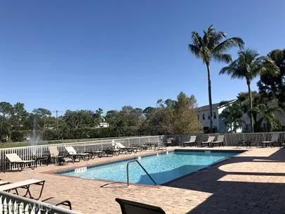 Community pool featuring a patio
