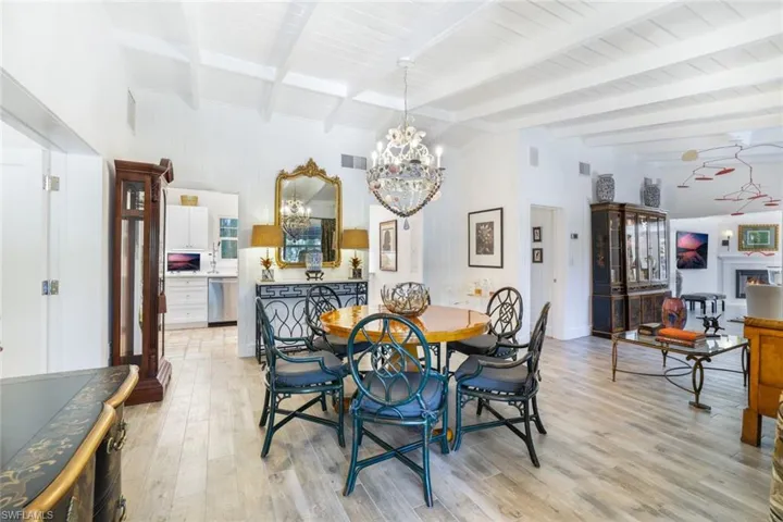 Has two openings into the kitchen, painted wood ceilings in part of the house.