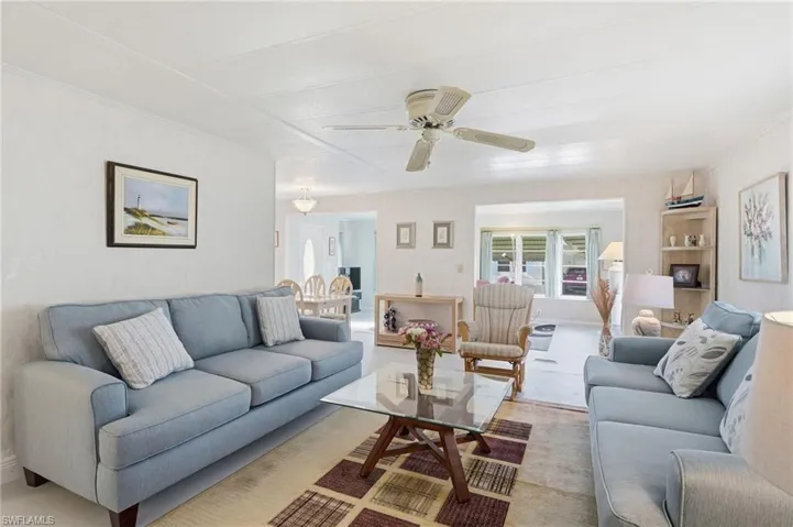Living room featuring ceiling fan