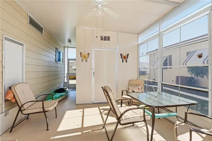 Sunroom with a Ceiling Fan and Screened with Windows