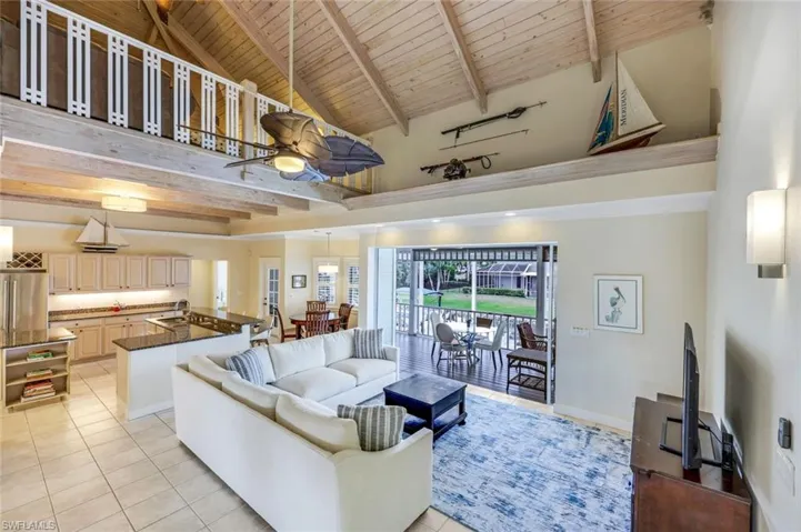 The living room leads you to the expansive lanai/pool area with STUNNING views.