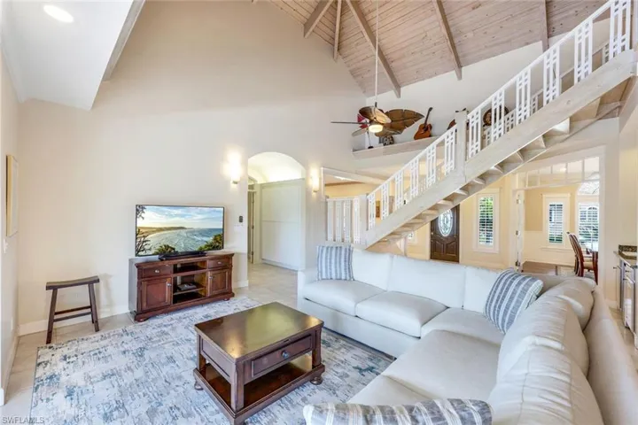 Notice the vaulted ceilings and intricate staircase.