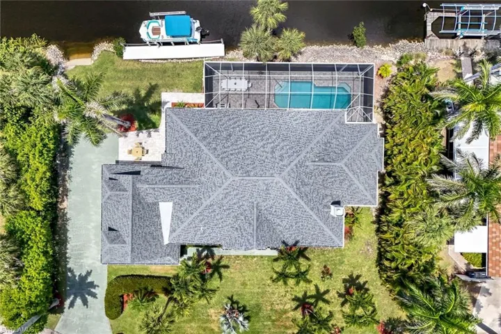 Gulf access pool home situated on an oversized lot just minutes from Downtown Bonita!