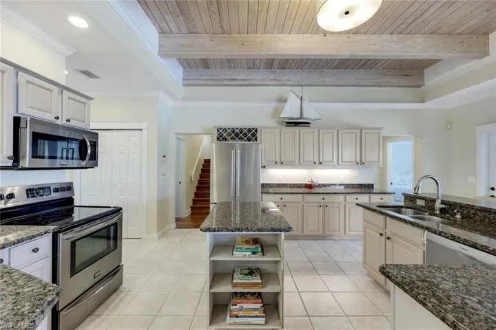 The kitchen provides a great deal of space, an informal dining spot and so much storage.