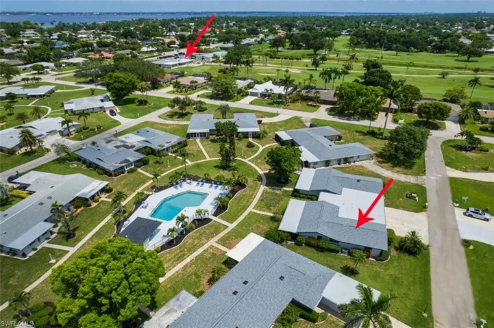 Aerial view of property's location with a nearby body of water