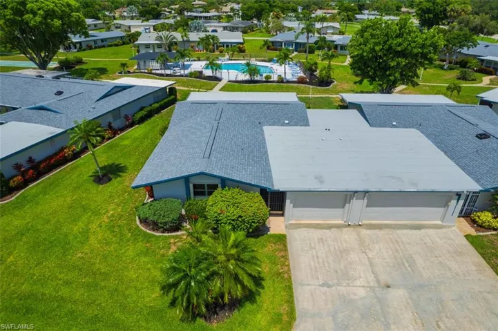 Aerial view of residential area featuring a pool area