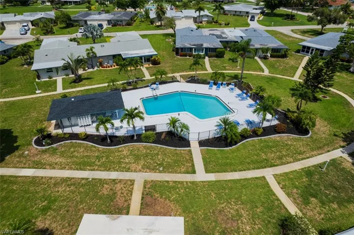 Aerial perspective of suburban area with a pool